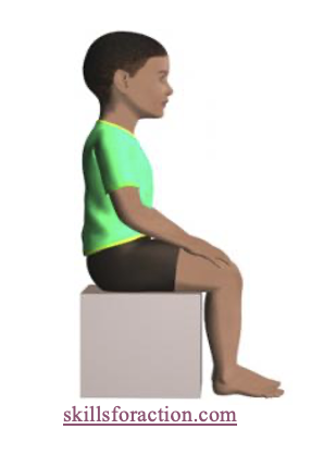 Image of a boy sitting on a box