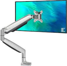 Photo of a monitor on an articulated arm mounted to the desk